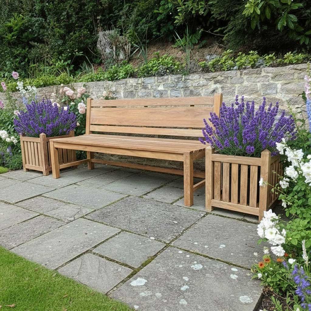 Wooden bench in a garden setting with lavender plants and stone pathway.