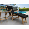Wooden lounge steamer chair with luxury black cushion next to a poolside table with drinks.