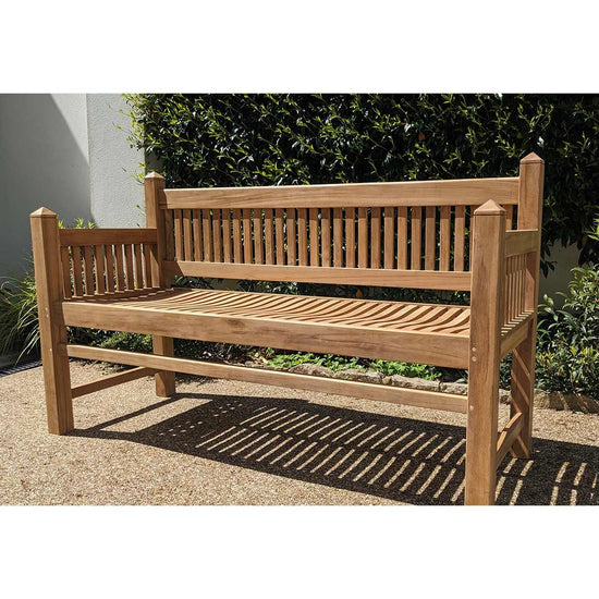 wooden teak garden bench, contemporary architectural design in a garden setting with greenery
