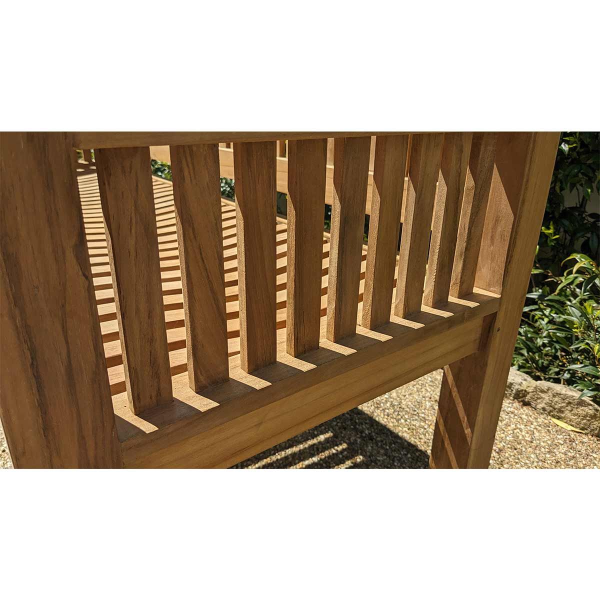 Wooden bench with a slatted design in an outdoor setting