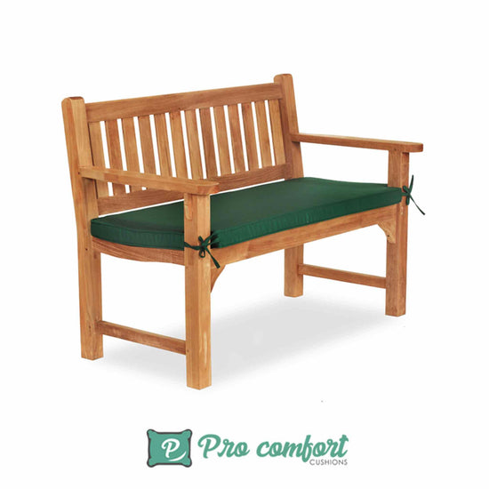 green cushion on a garden bench