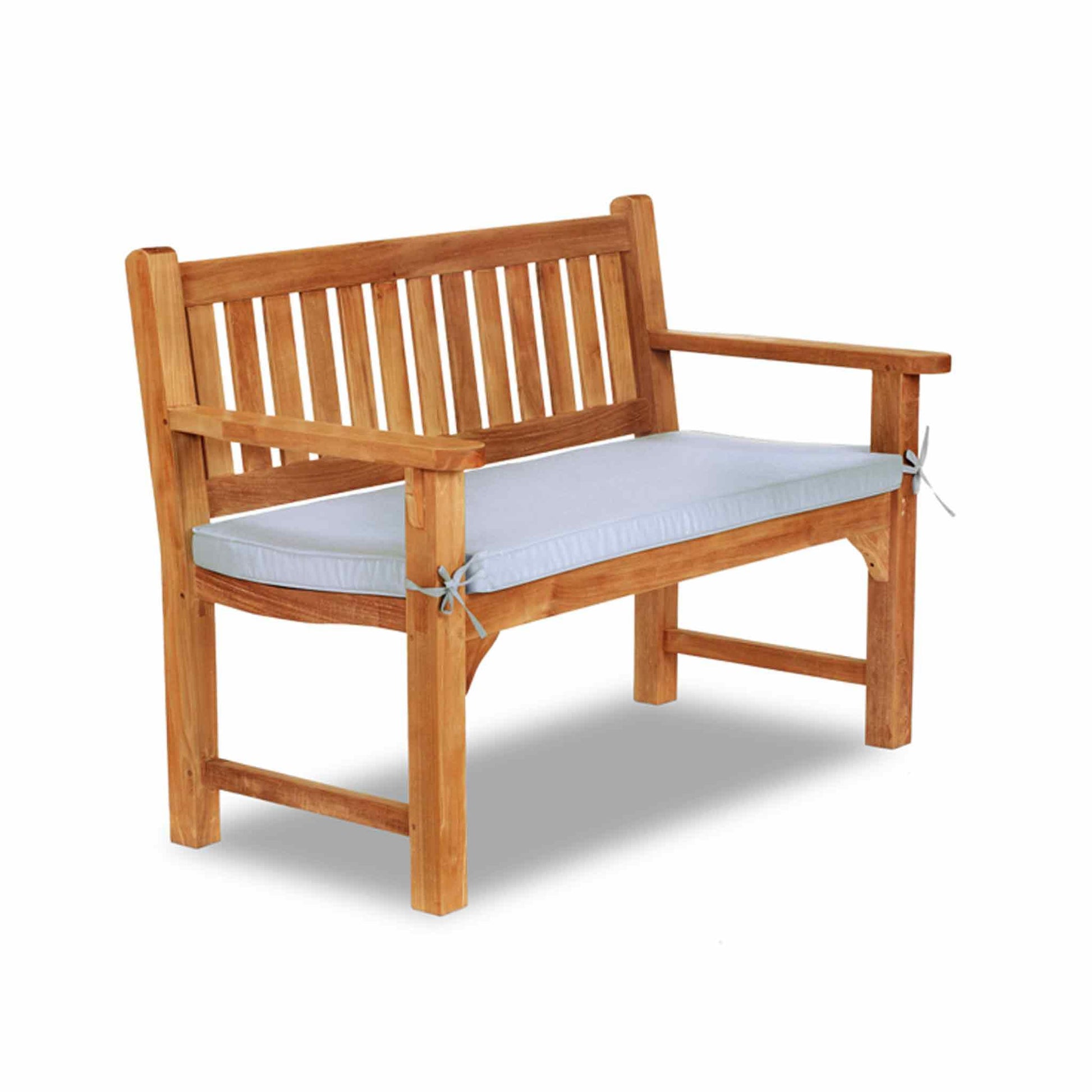 white cushion on a garden bench