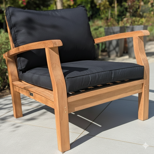Wooden outdoor chair with black cushions on a grey patio
