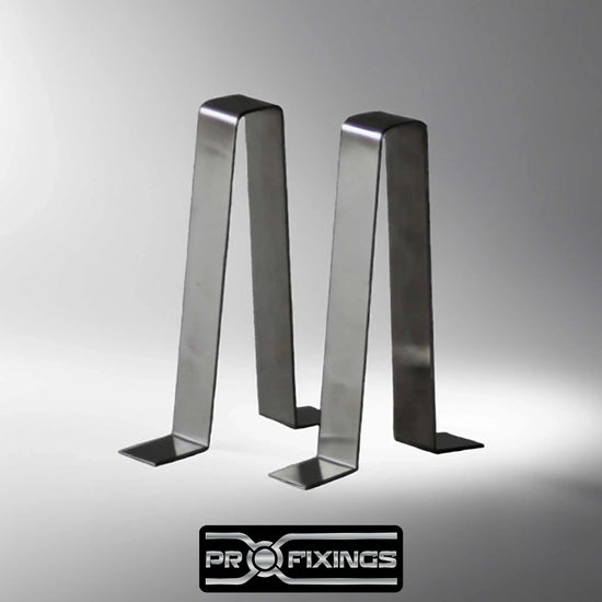 a pair of stainless steel garden bench braces in a grey studio setting