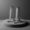 stainless steel garden bench braces on a concrete plinth