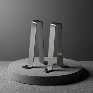 stainless steel garden bench braces on a concrete plinth