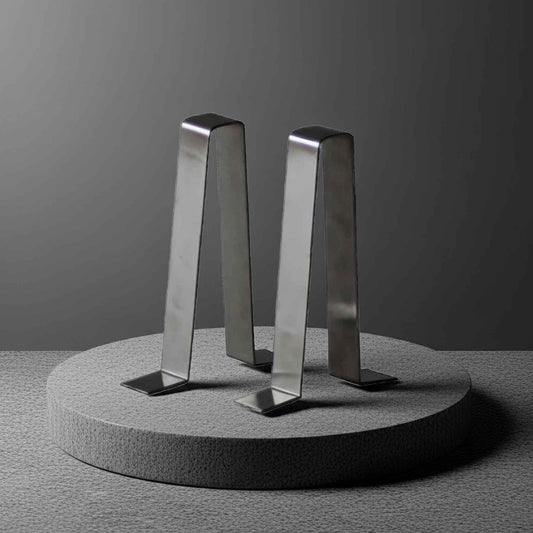 stainless steel garden bench braces on a concrete plinth
