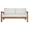 Wooden sofa with white cushions on a white background