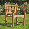 Wooden teak garden armchair, Farleigh, in a garden setting on a lawn