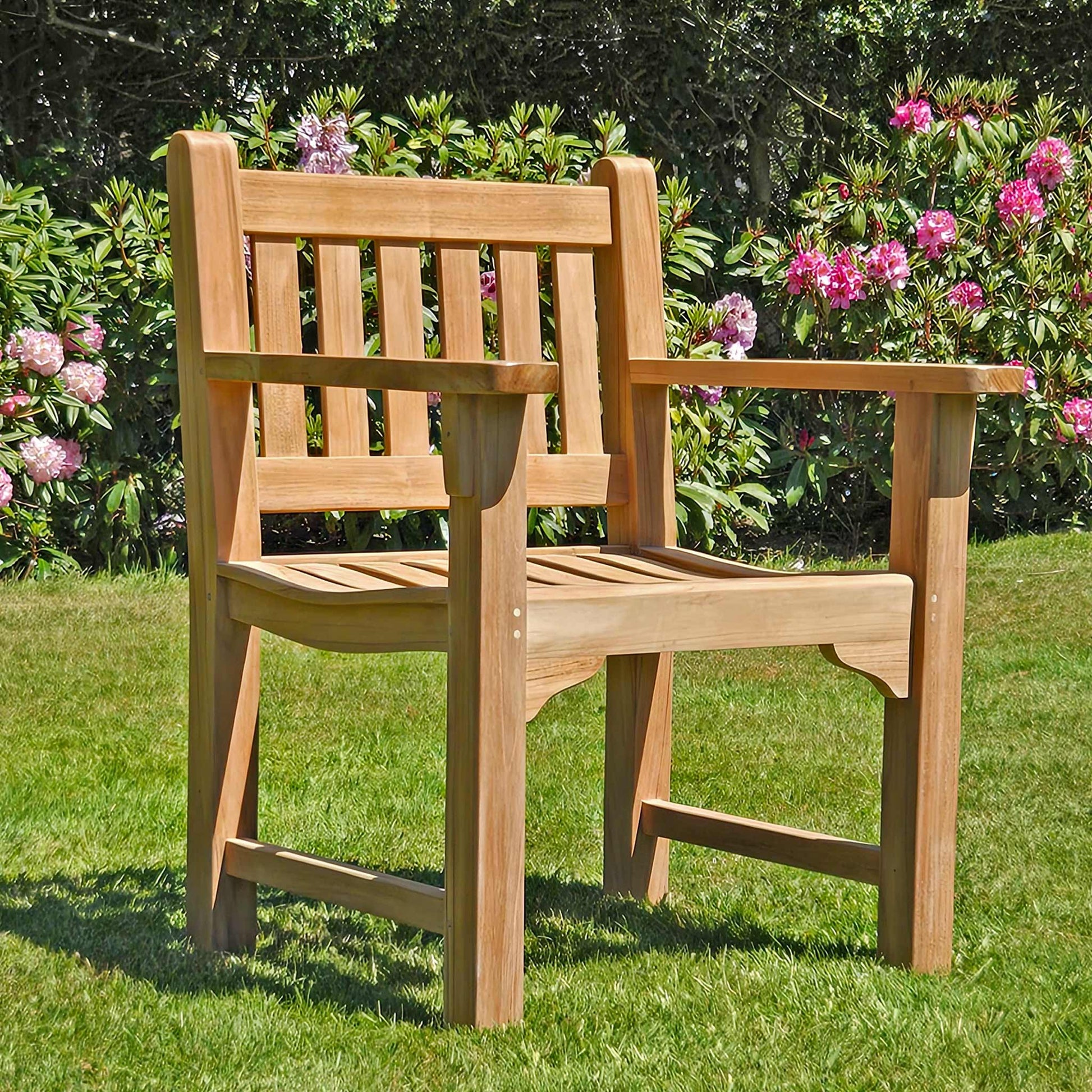 Wooden teak garden armchair, Farleigh, in a garden setting on a lawn