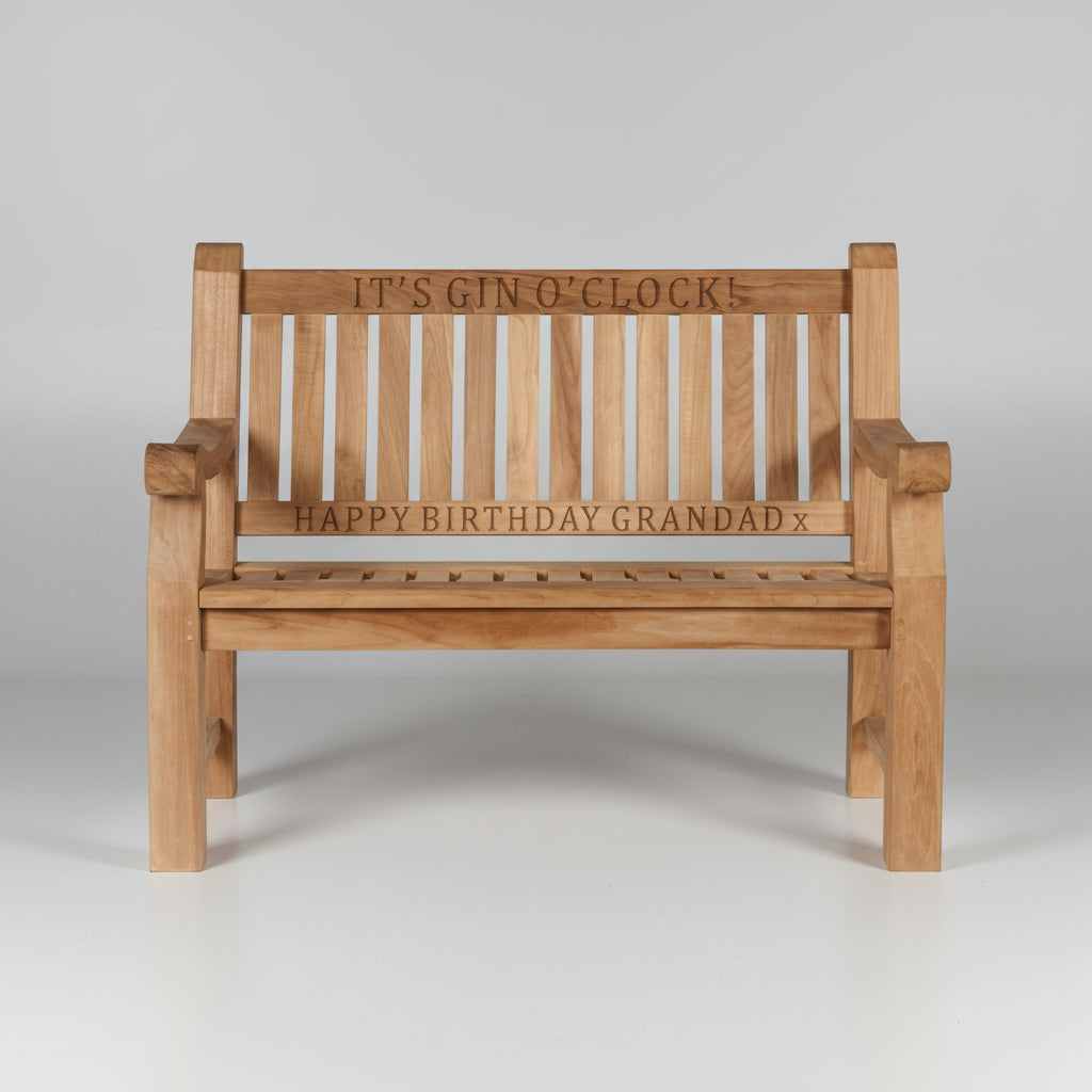 Wooden garden bench with engraved text on a white background