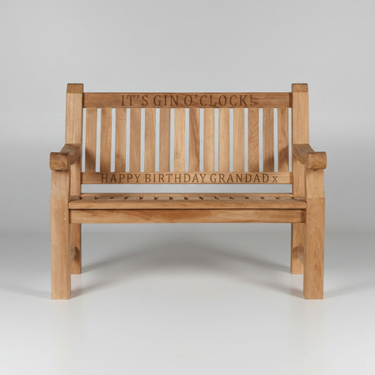 Wooden garden bench with engraved text on a white background