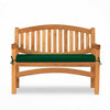 Garden bench with green cushion on a white background