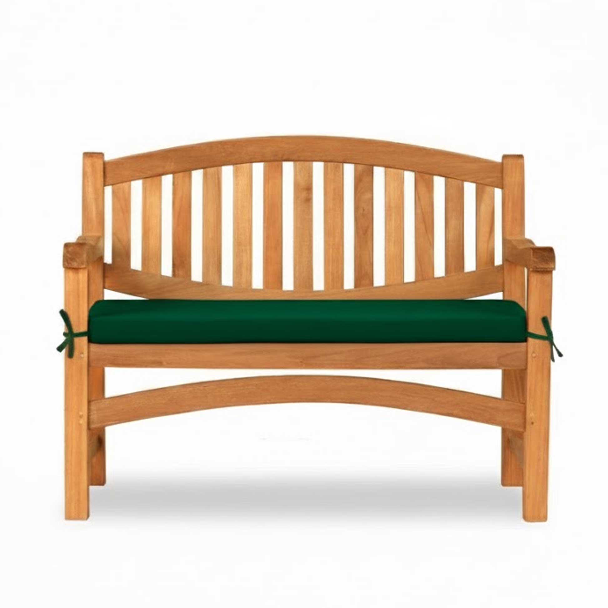 Garden bench with green cushion on a white background