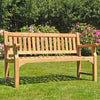 classic 3 seat teak garden bench, sandhurst, in a garden setting