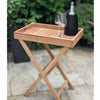 Teak Serving Platter and Garden Side Stand with glasses and a bottle on a patio