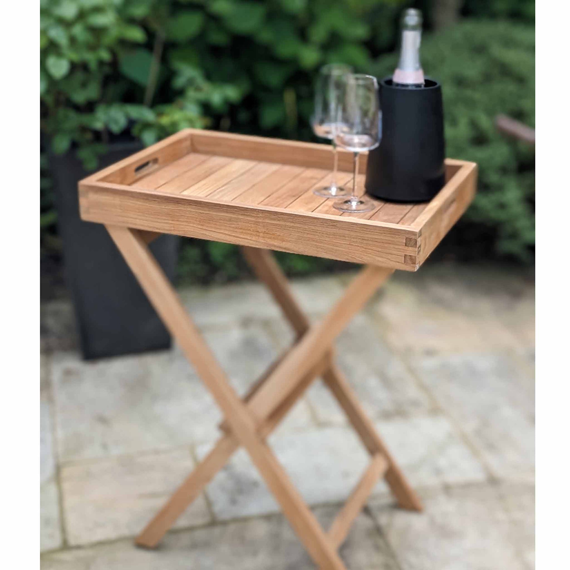 Teak Serving Platter and Garden Side Stand with glasses and a bottle on a patio