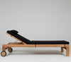 Teak wood sun lounger, with wheels,  black cushions white background