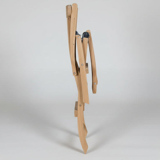 Wooden teak garden steamer folding chair on a white background